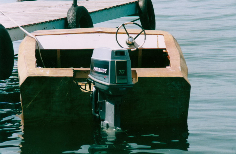 Stern view featuring rebuilt outboard
